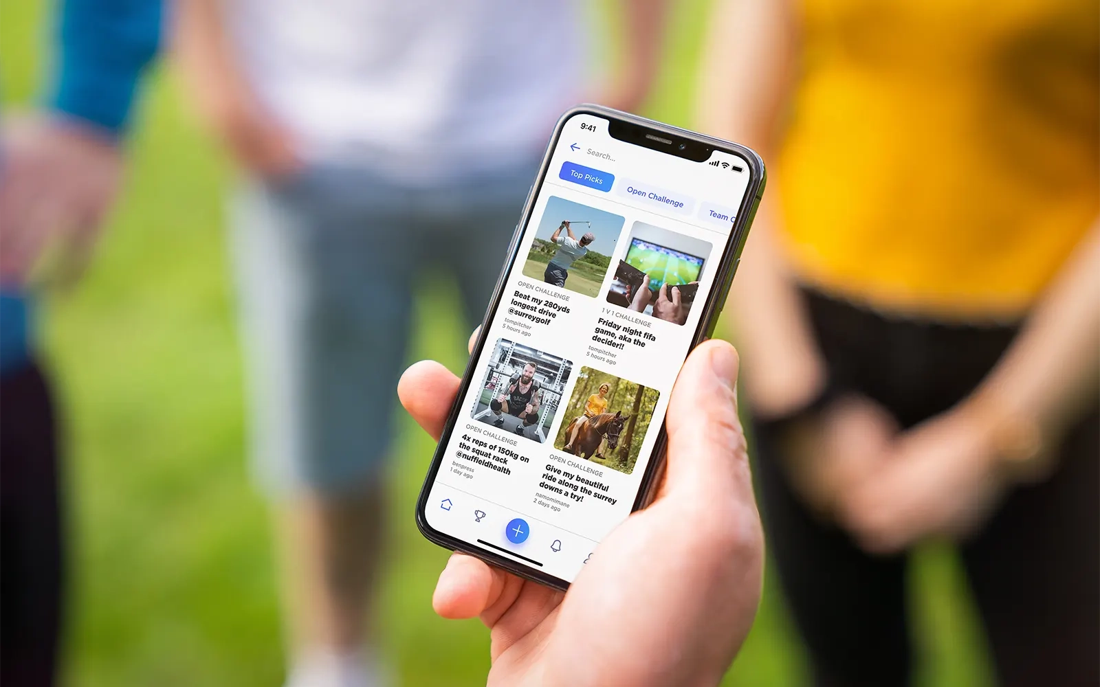 A close up of a smart phone showing the search page from the Challenge Social app