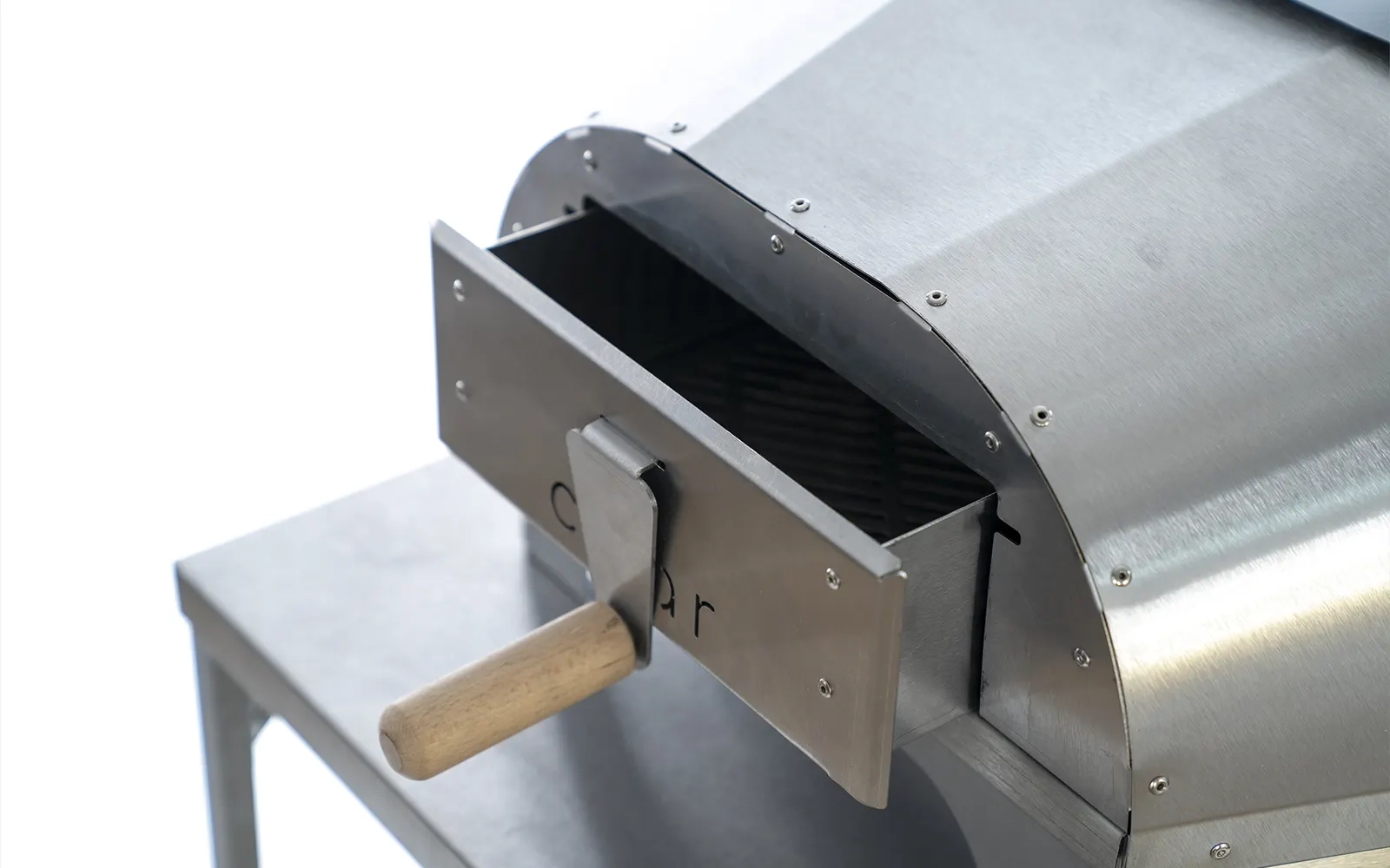 Close-up of the rear of The No.16 pizza oven with the hopper open against a white background