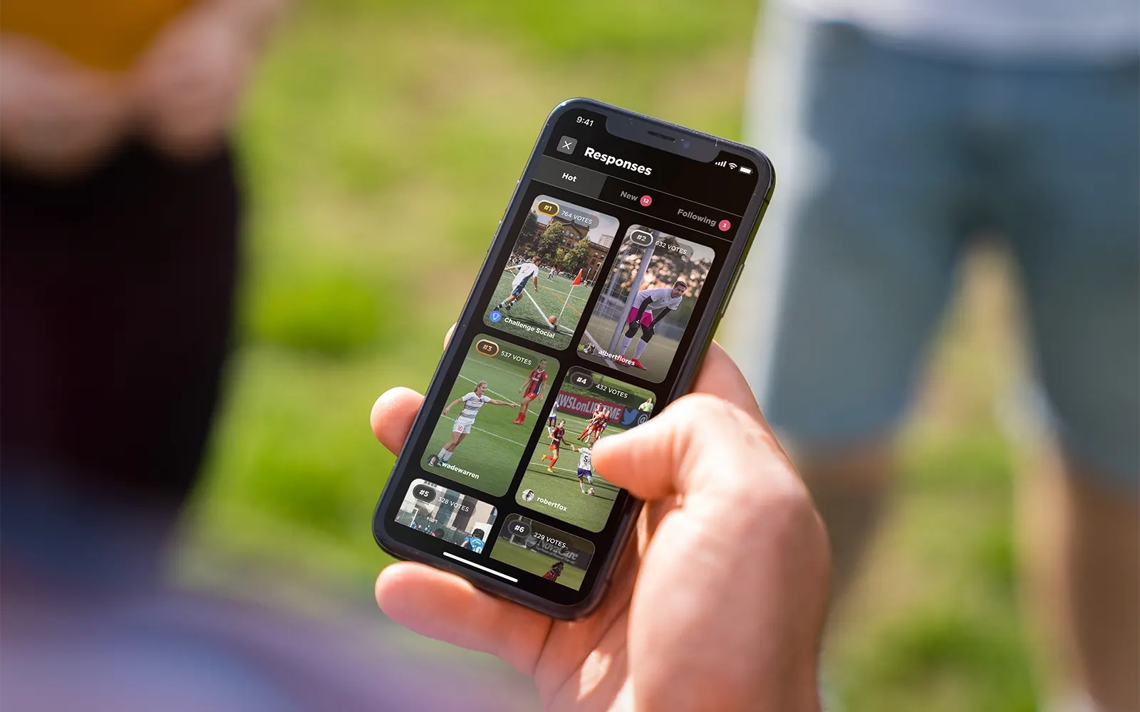 A close up of a smart phone showing the responses page from the Challenge Social app