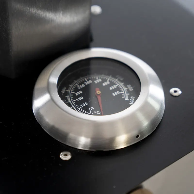 Close-up of the temperature guage of the pizza oven